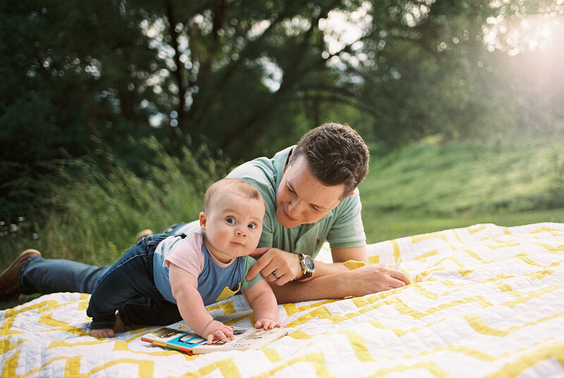 Kids in a pile on grass at Finger Lakes family photography session, New York