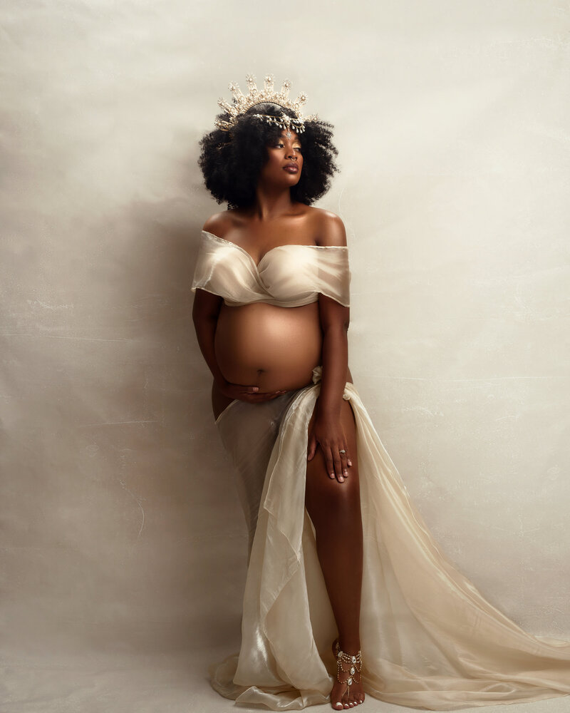 Maternity goddess with a crown in syracuse ny studio, Softly styled maternity image capturing grace, strength, and beauty of pregnancy