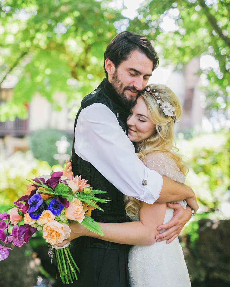 Bride + Groom share a hug at Harvest Inn