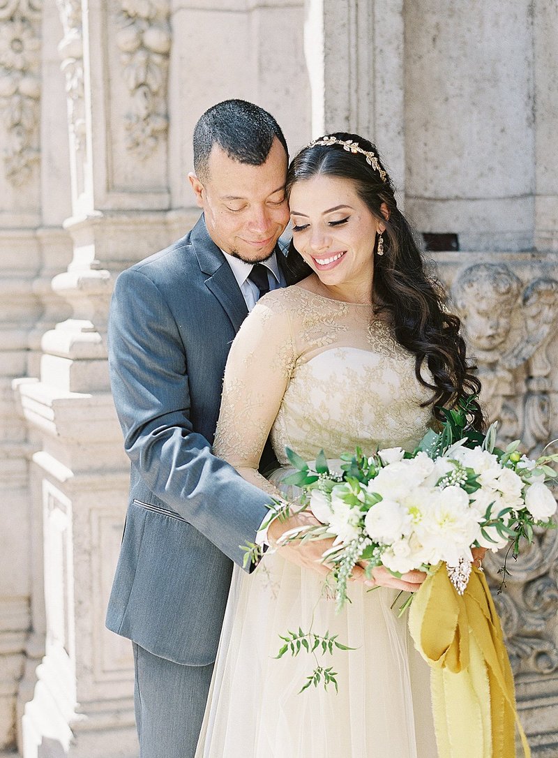 The classic historical Mission Inn in Riverside, California was a breathtaking backdrop for this mini elopement. Lush organic florals in white and cream with trailing foliages added provided romance for this intimate celebration.