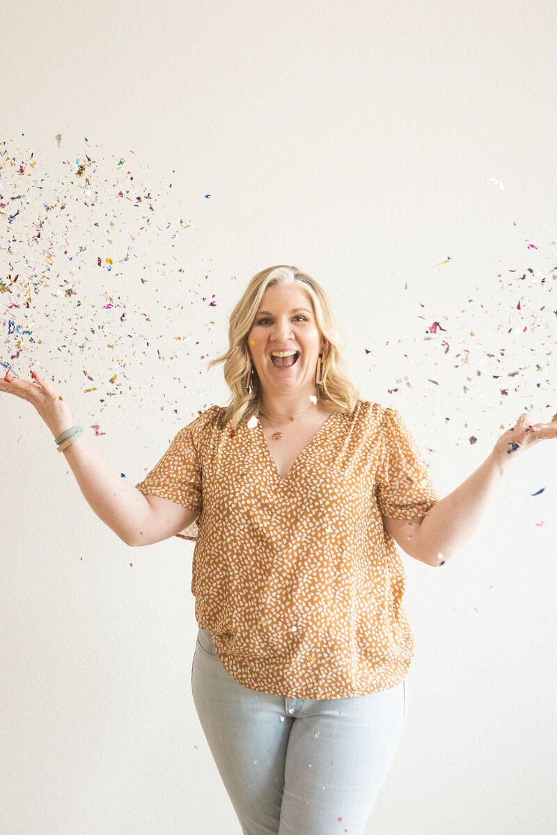 Lacey throwing confetti in celebration