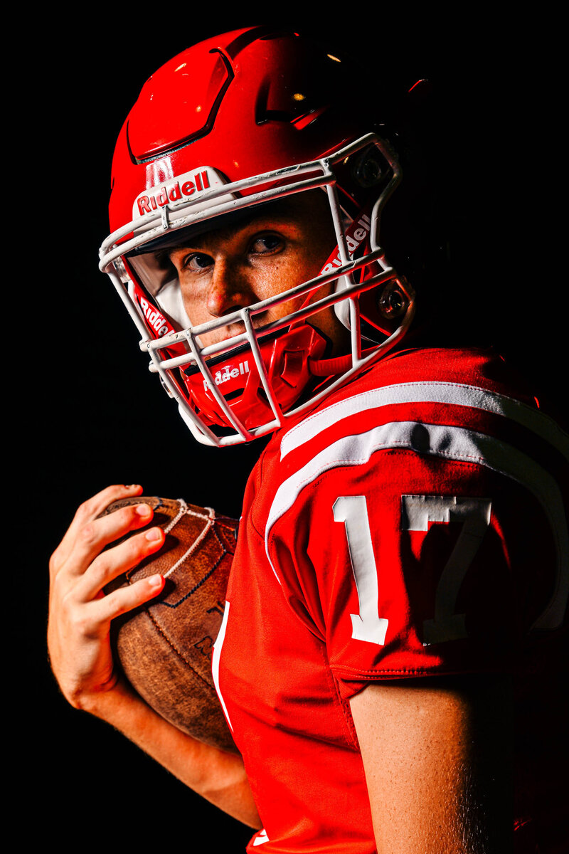 a dalton football player poses with his jeep during a photos hoot