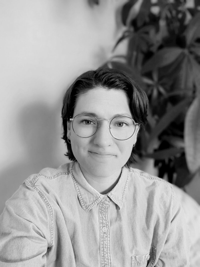 Ali, a therapist who offers holistic counseling at Boise Experiential Therapy Collective smiles at the camera.