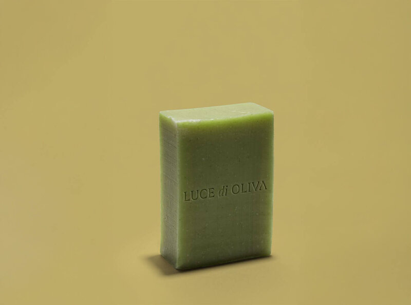 Colorful Mediterranean olive oil soap bars stacked showing natural skincare products by Luce di Oliva.