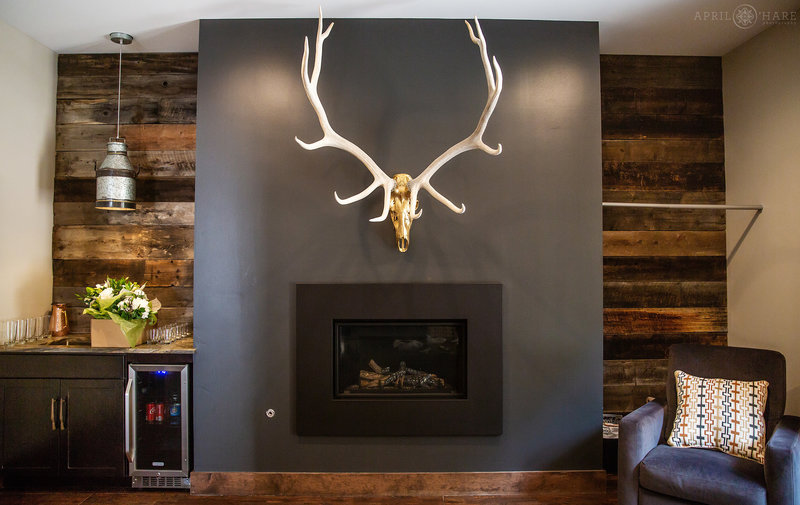 Antlers hang above fireplace at Blackstone Rivers Ranch in Idaho Springs Colorado
