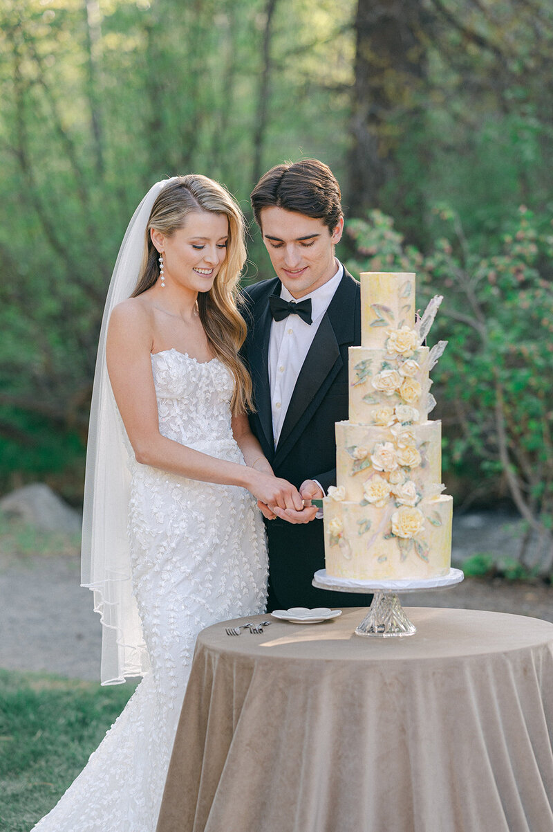 Bride and Groom standing in a meadow at Dancing Pines Wedding Venue in Truckee, CA.