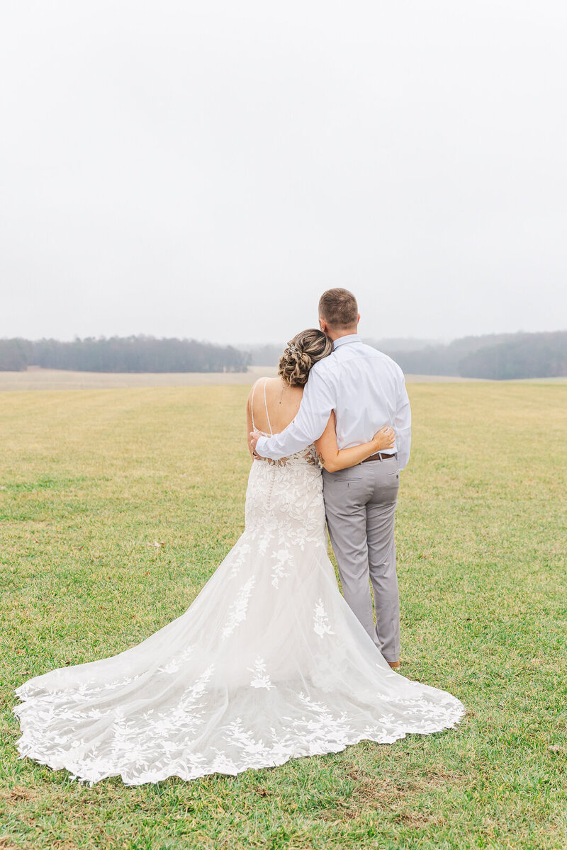Newlyweds looking at mountains