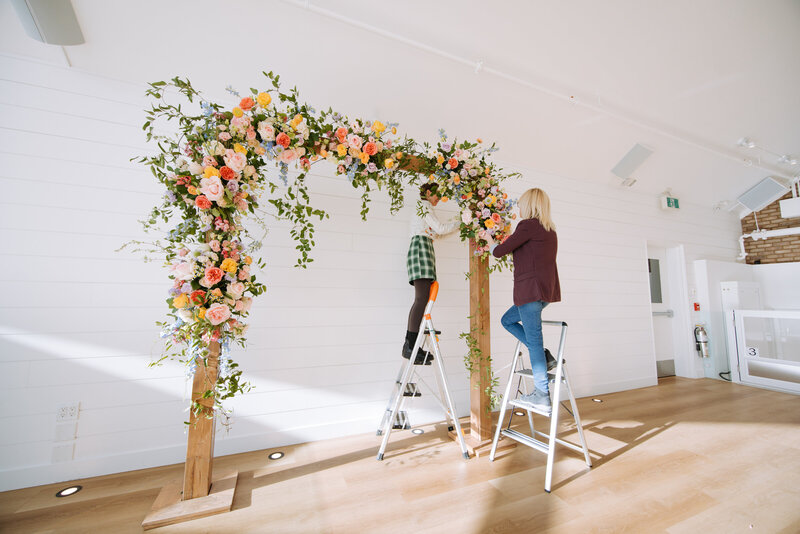 Rocky Mountain wedding florals with a custom-designed arch full of colourful blooms and natural textures.