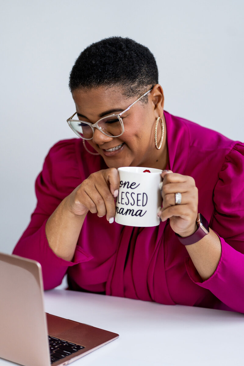 A woman actively working on her laptop, embodying women’s leadership coaching and professional empowerment through focused career guidance.