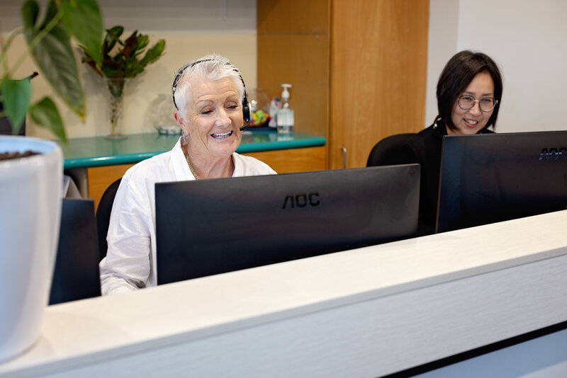 QE2 Dental receptionists talking to patient on the phone