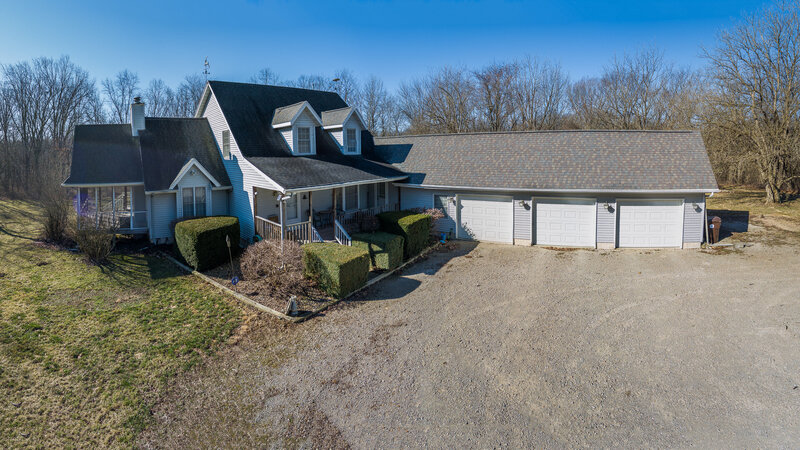 Three car garage and more feaatured for this house for sale in the countryside in Illinois