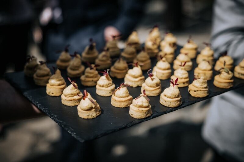 Scrumptious canapes on a slate trey