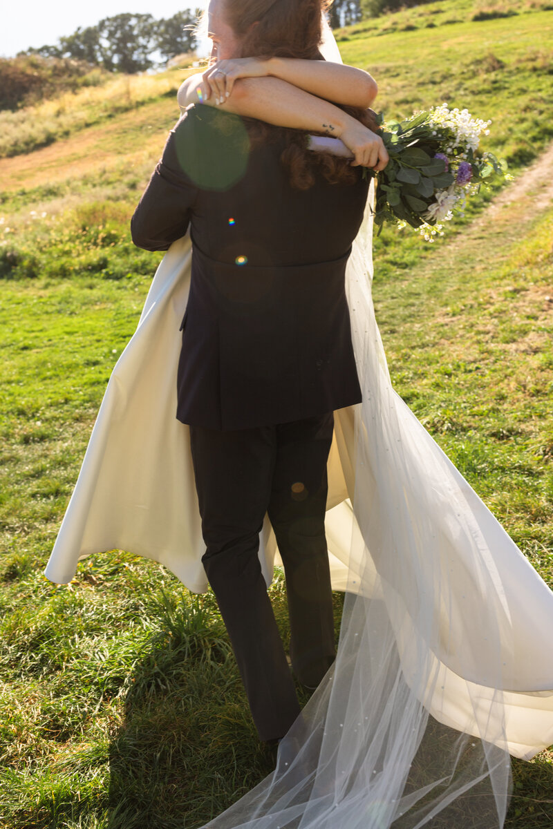 Couple in Duluth Minnesota embraces one another after their ceremony