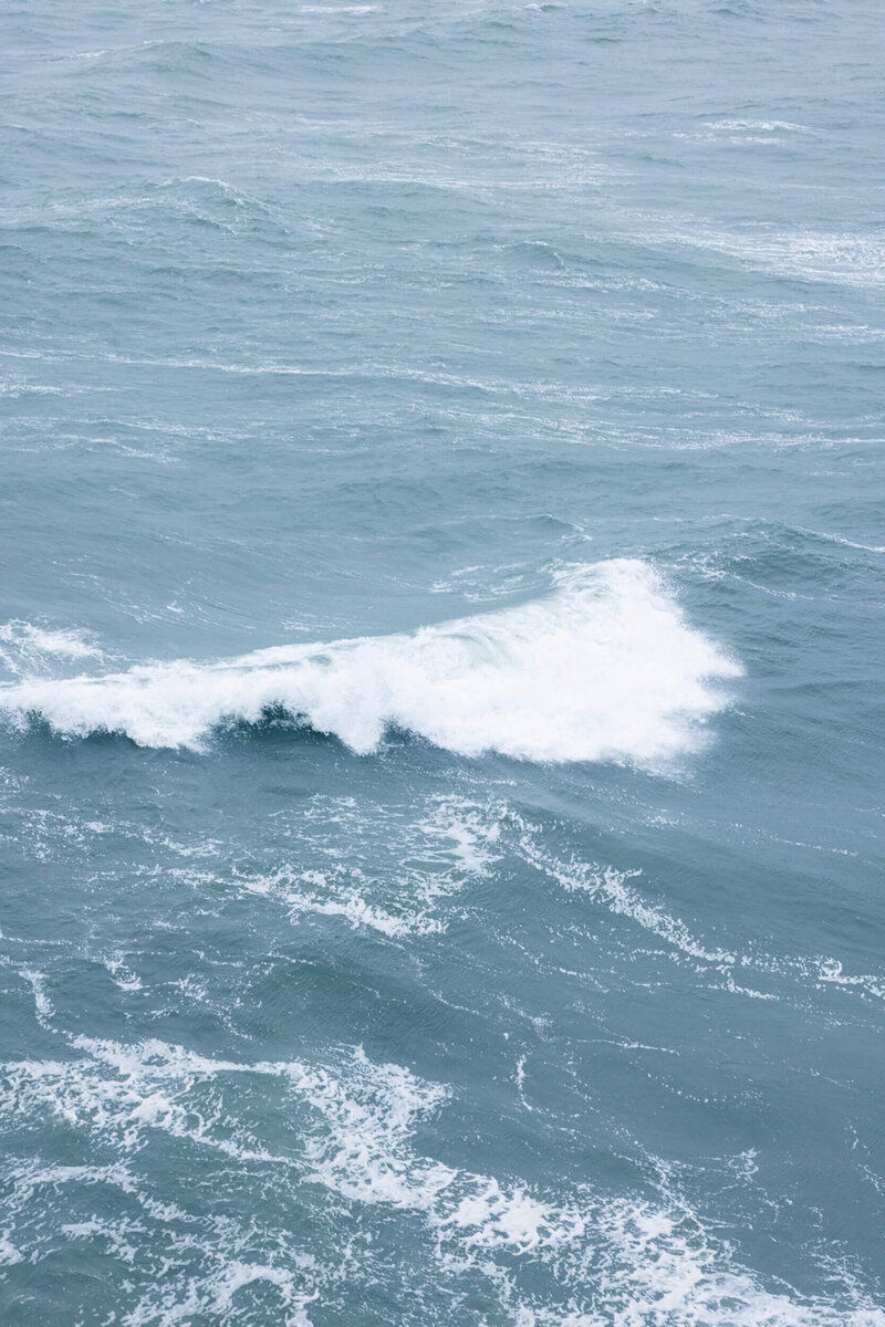 A picture of waves breaking below the cliffs of Moher