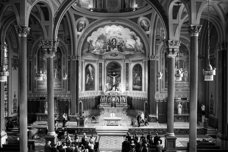 Black and white photo of a wedding ceremony at Mother of God Roman Catholic Church in Covington, Kentucky