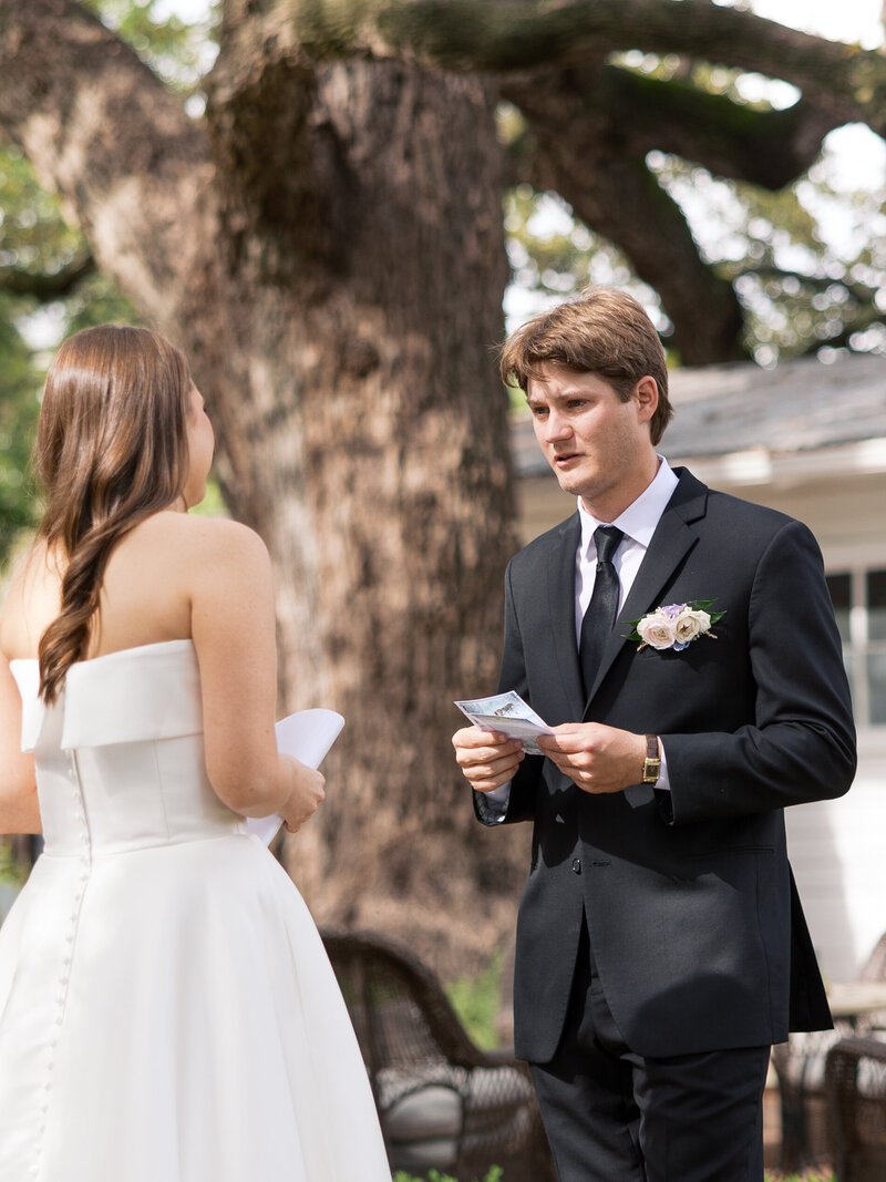groom-smiling-during-private-vows
