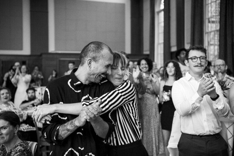 People hugging at Halifax wedding.