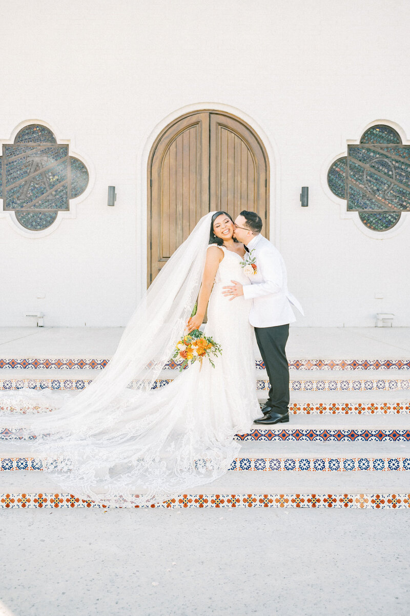Fort Worth Wedding Photographer | DFW Photographer Rae De Lain Weddings Light and Airy | Groom kisses bride on cheek