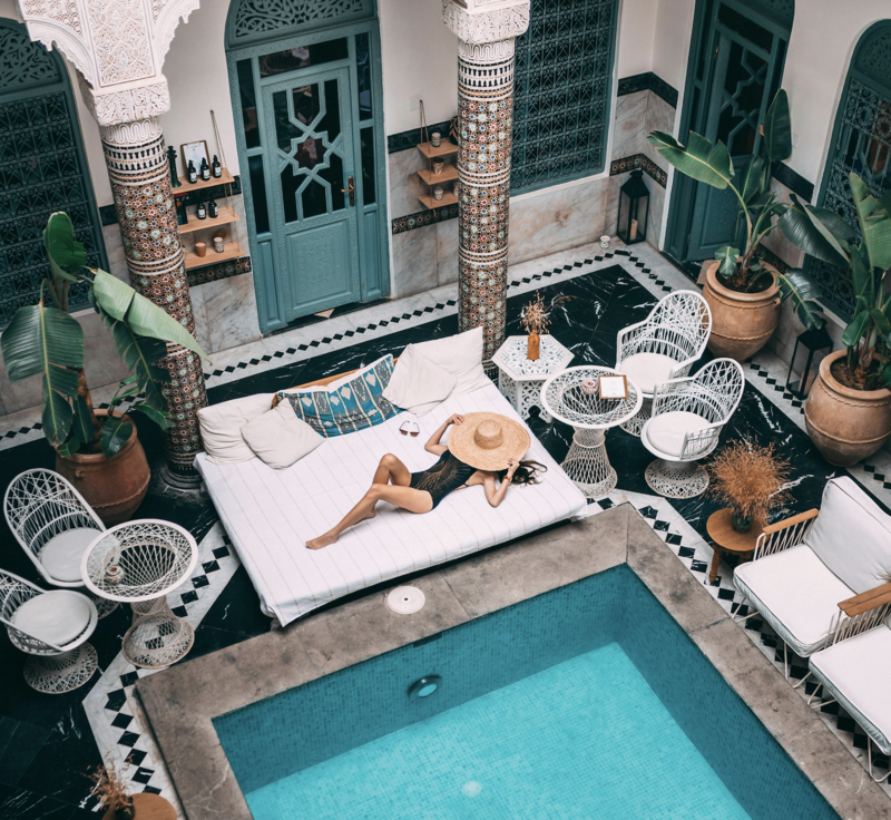 women sunbathes in Moroccan Riad