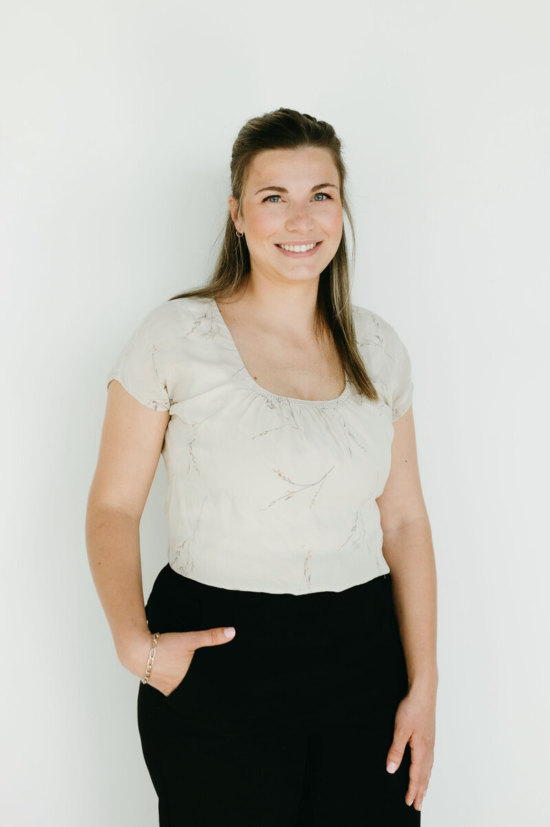 Headshot of Alex with white background.