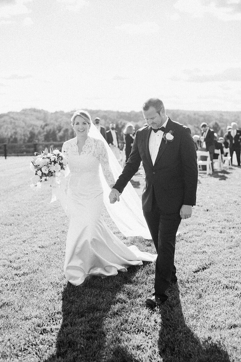 Bride and groom walk up memorial steps at their DC wedding