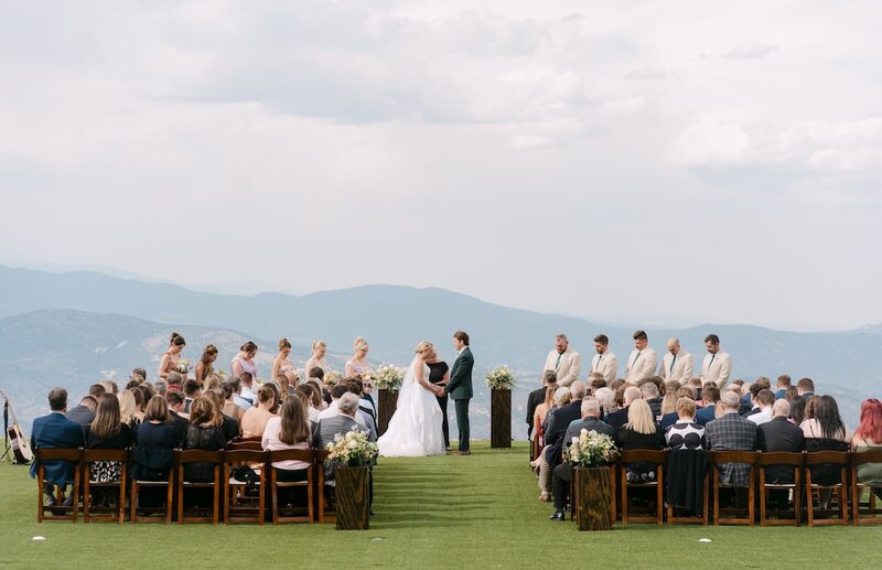 Outdoor Colorado mountain wedding ceremony photographed at Echo Mountain in Idaho Springs by a Colorado wedding photographer.
