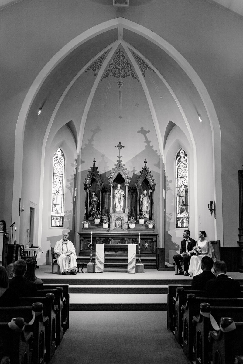 Wide view of the bride and groom at the church during their ceremony