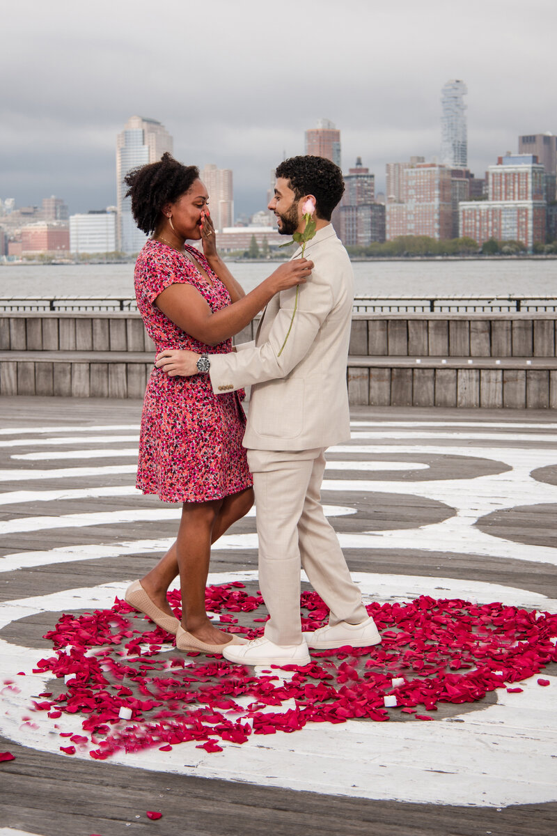 Fady & Omni-Yeminese man proposing to african american girl at exchange place