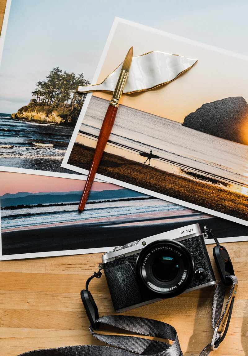 Image of a camera and fine art photographic prints by Seattle adventure photographer Amy Duffy