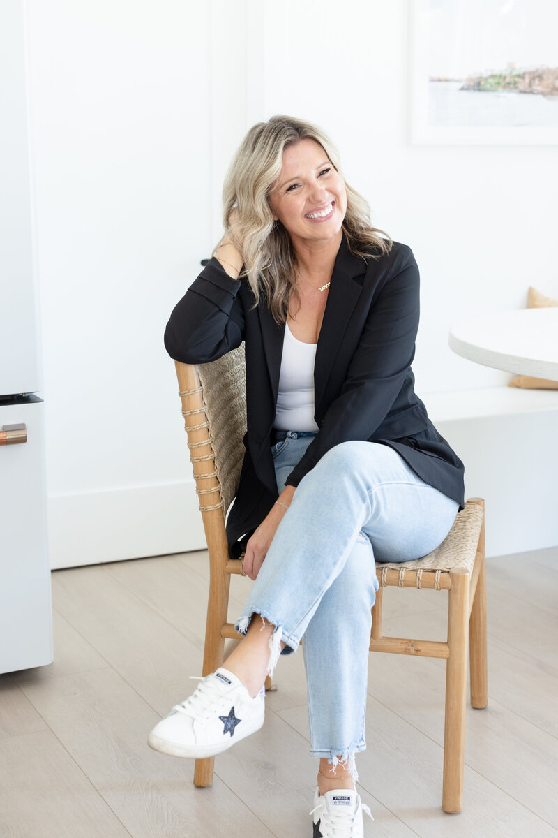 A warm, inviting image of Tara opening her door in Queen Creek, welcoming women entrepreneurs into the Connect Belong community with a friendly and open embrace.