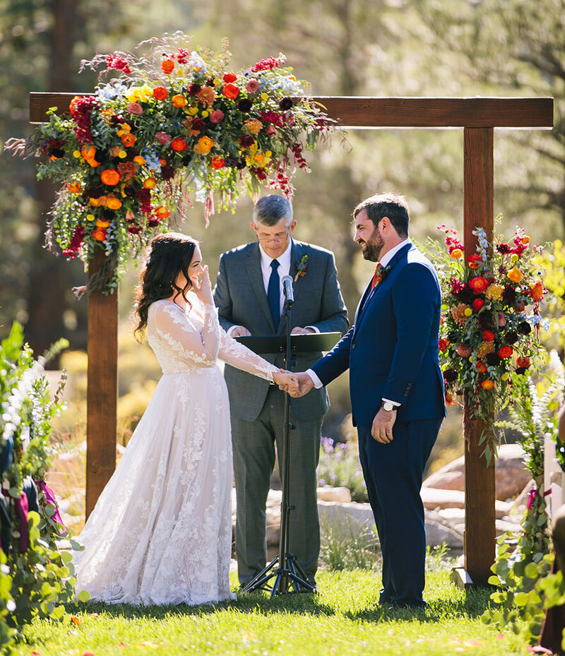 Bride shows authentic emotion during her wedding ceremony at Cienaga Creek Ranch