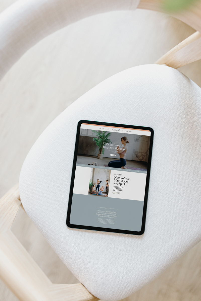 View a custom Showit website displayed on an iPad, set against a sleek white chair. A perfect blend of modern design and functionality, showcasing a responsive and elegant website layout.