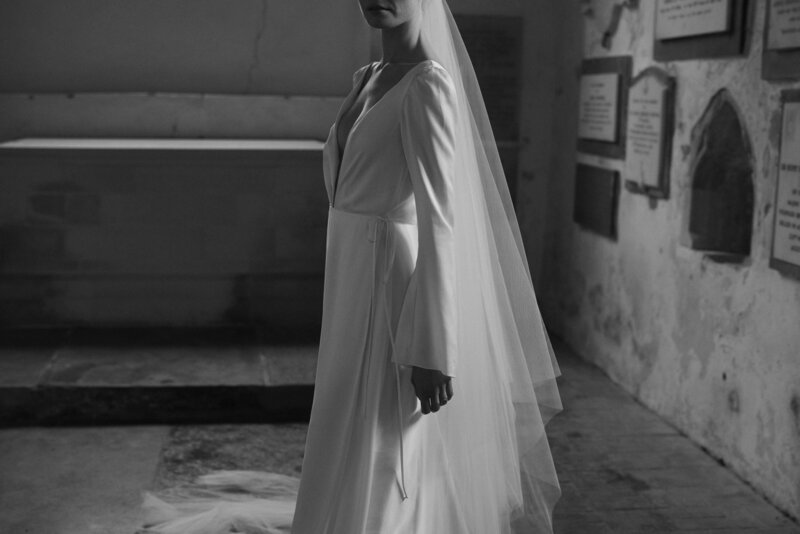 Long, silk wedding dress on natural bride by british wedding dress designer, Luna Bea