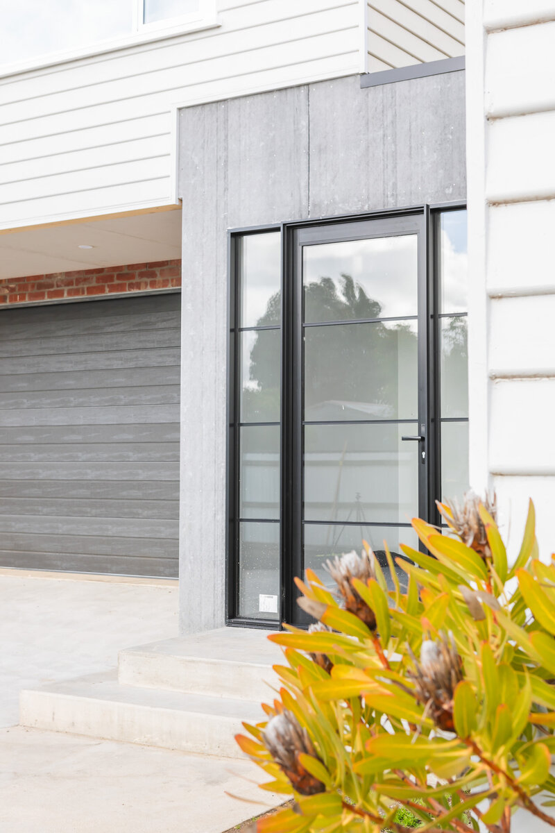 Glass entry to new custom home build by WBK Building