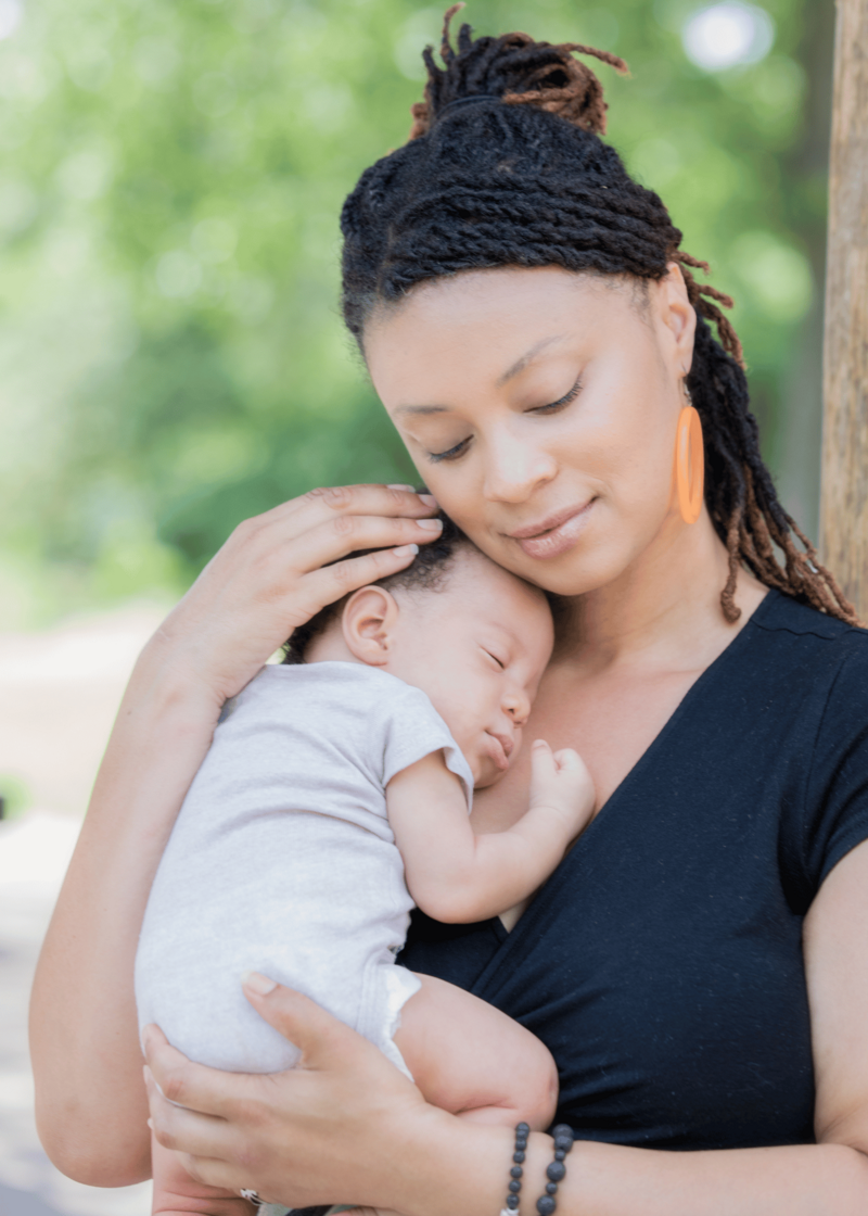 Mom holding baby after perinatal mental health  therapy