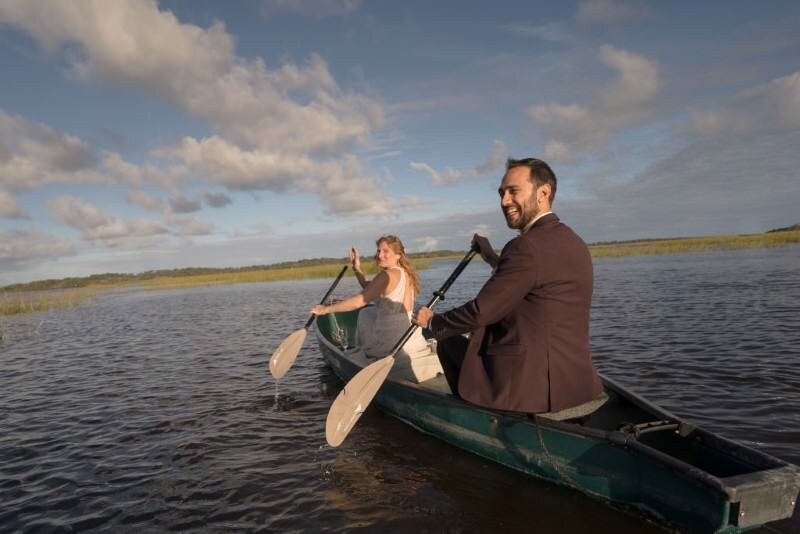 Couple canoeing on serene lake