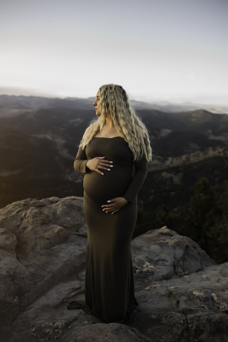 Pregnant woman in Boulder Colorado in mountains