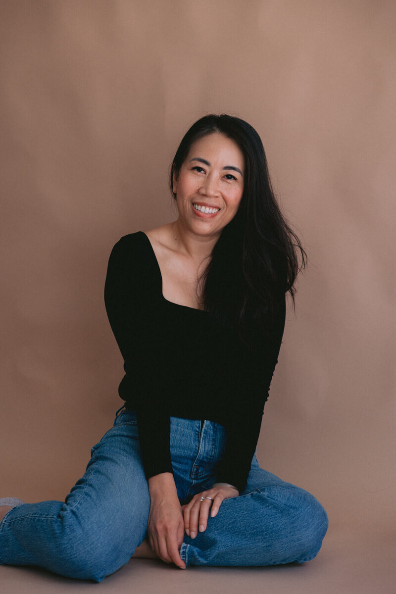 color photo of cassy velazquez photography wearing black shirt and jeans