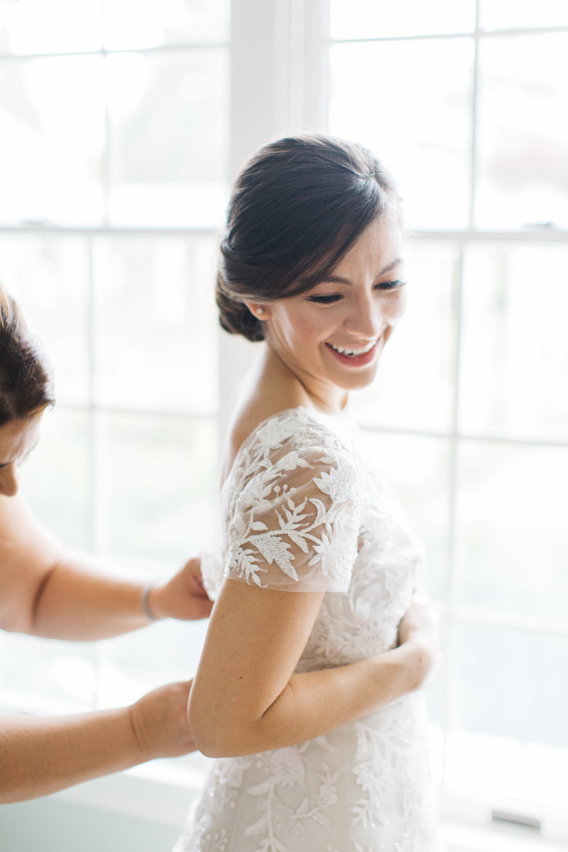 bride laughing getting ready