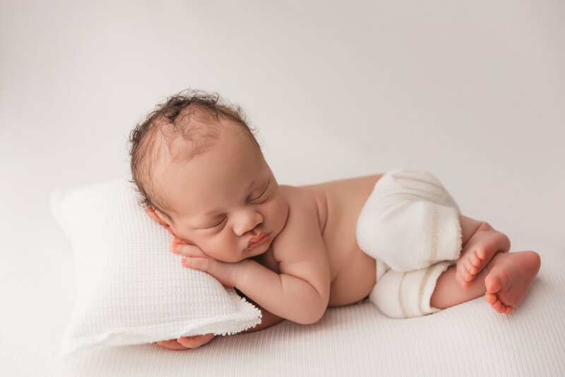 Baby posing for infant photoshoot in phoenix studio