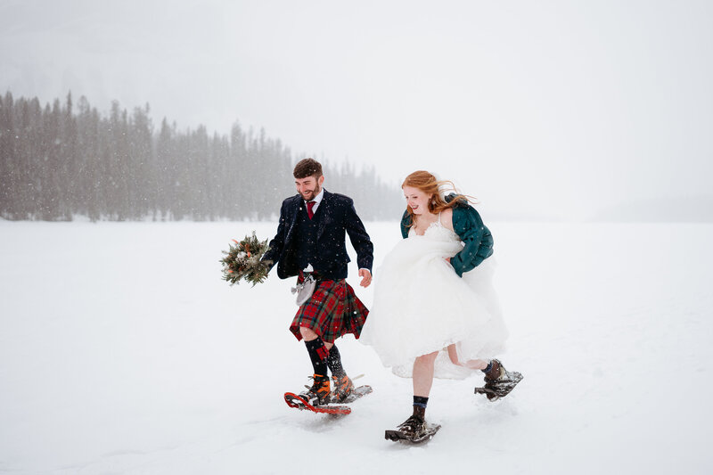 Married couple snowshoeing in Kananaskis