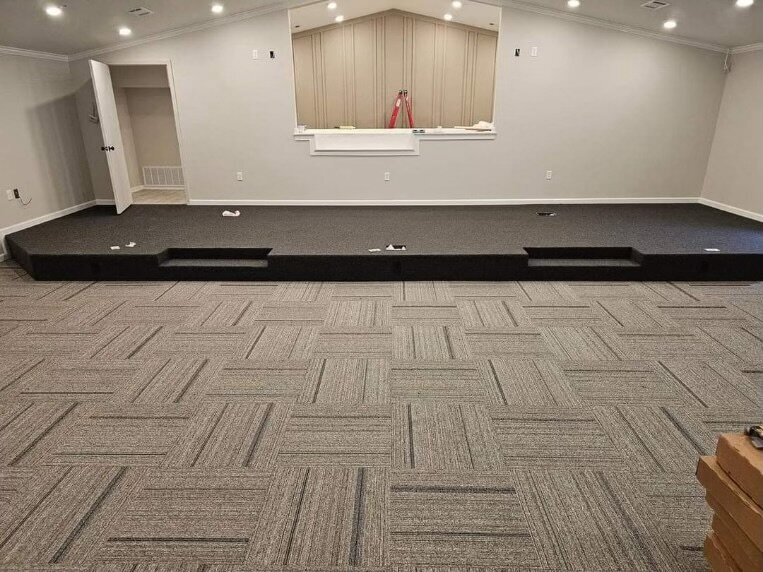 Light gray patterned carpet at a church.