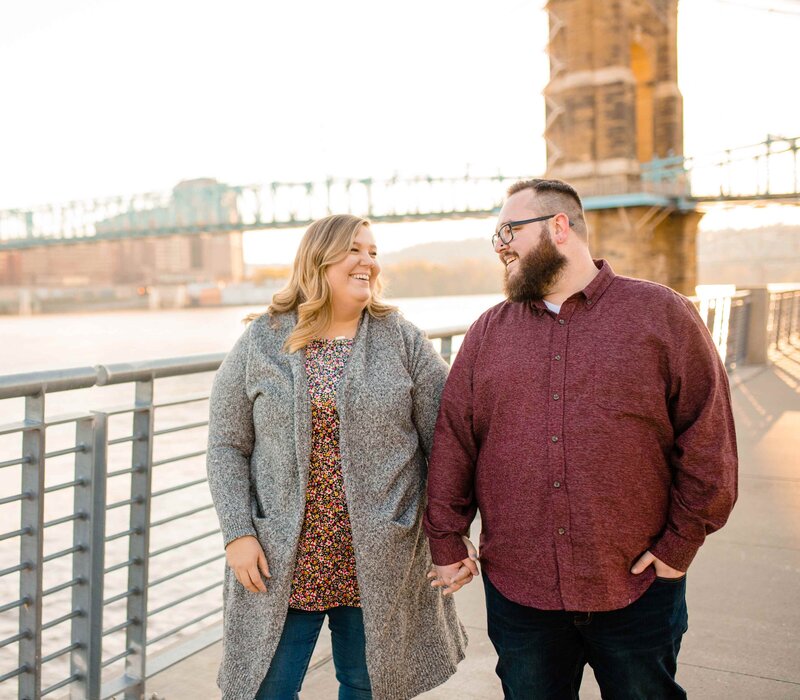 Couple walking in front of Roebling Bridge