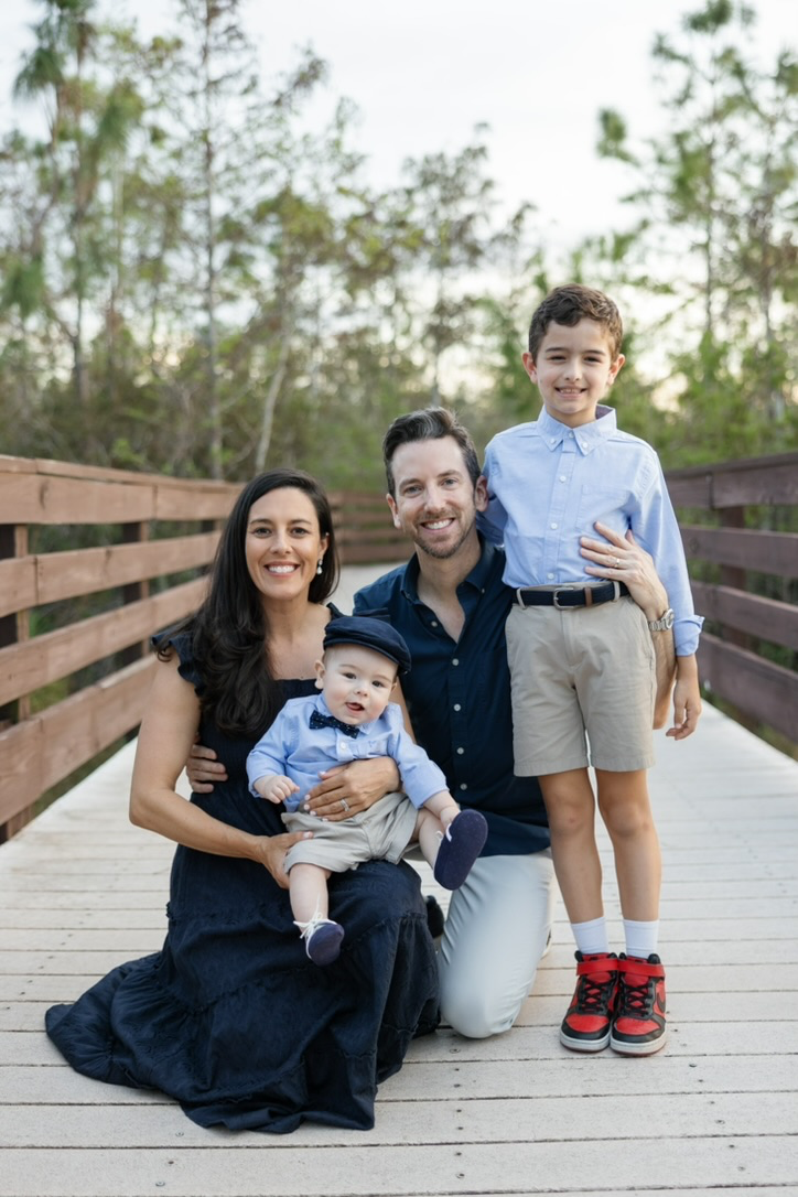Renee O’Higgins, PGA and LPGA golf instructor posing for a family portrait.