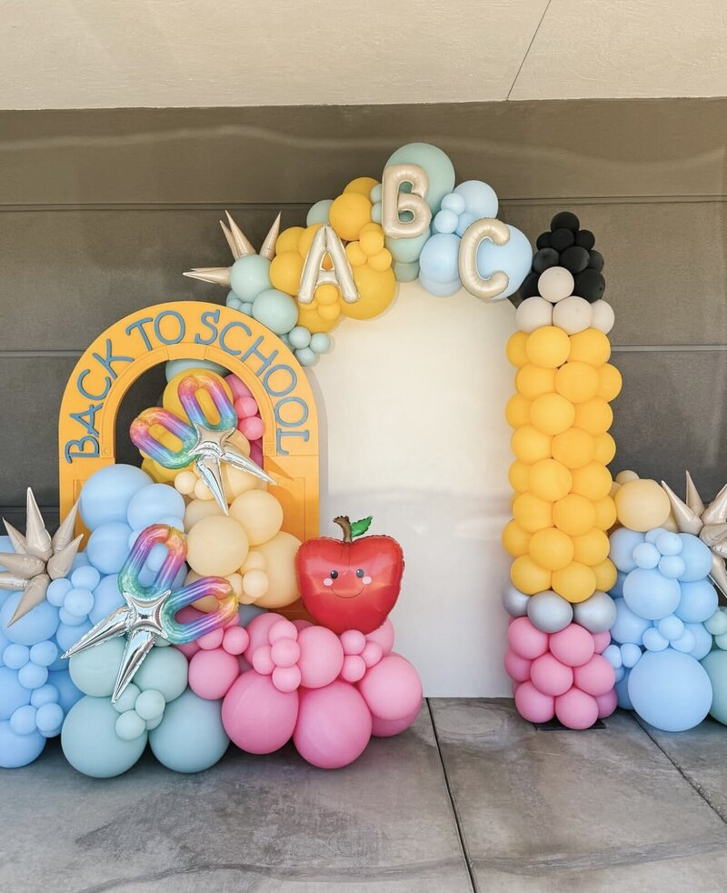 Custom balloon installation with two backdrops and balloon garlands