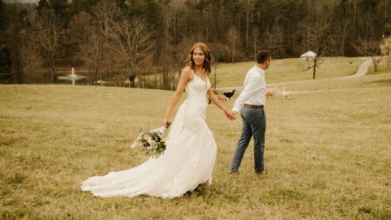 bride and groom in pasture with boys