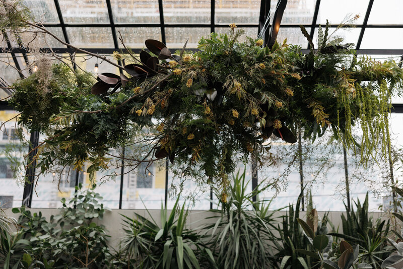 Botanical floral installation hanging from four season solarium Q Jancola