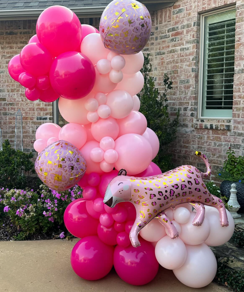 different shades of pink balloons with leopard birthday party theme