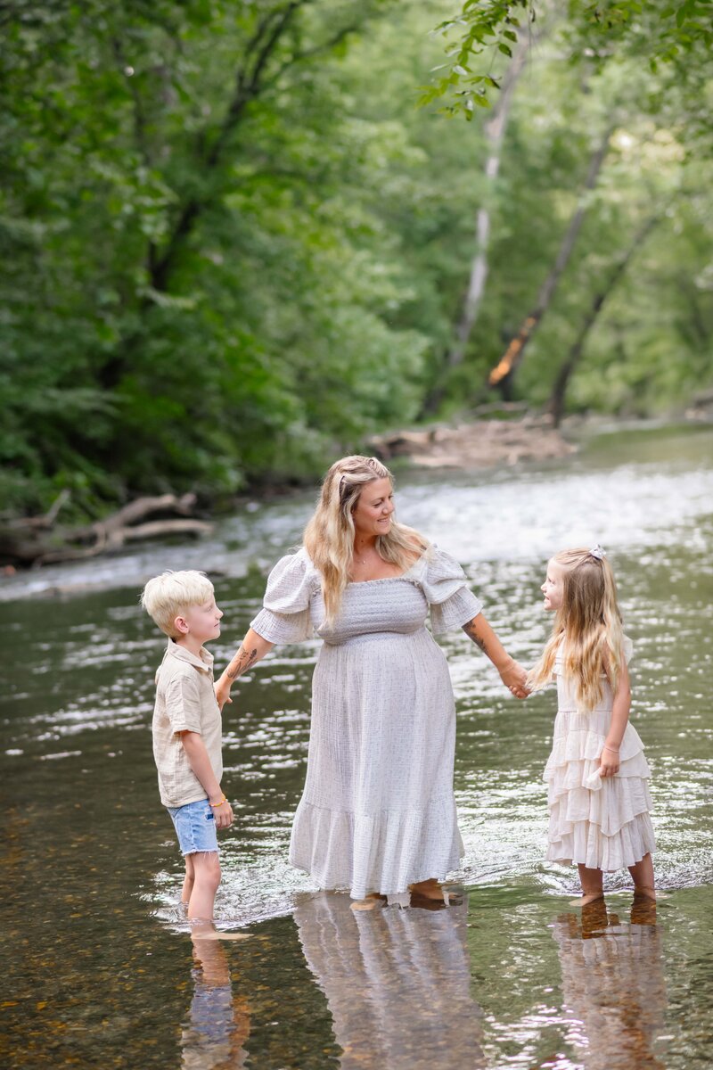 A family posing for fall mini sessions in park