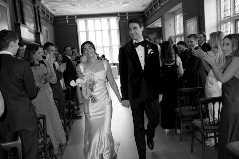 Couple exchange vows in an intimate indoor ceremony filled with character and warmth.